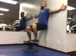 Wall Squat on StrongBoard Balance Board for Lower Body Burn