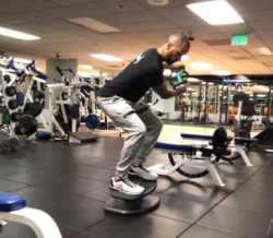 Tone Your Back Fast with This Calorie Burning Exercise - Bent-Over GripBell Swings on StrongBoard Balance Board
