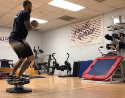 Tighten Your Core and Increase Stability with Rebounder Throw and Catch on StrongBoard Balance Board