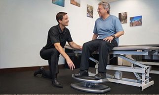 Physical Therapist works with patient and StrongBoard Balance